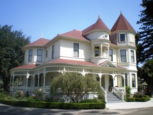 White victorian house with red roof